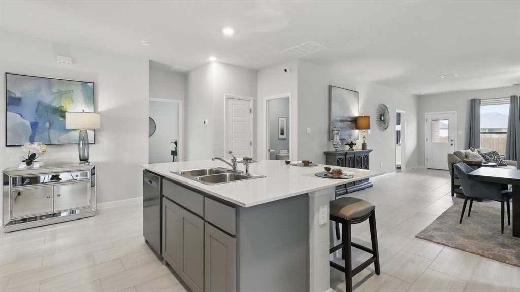 1205 Tree House Lane Decatur, TX 76234 - Photo 4 of 35 a kitchen with sink cabinets and stove