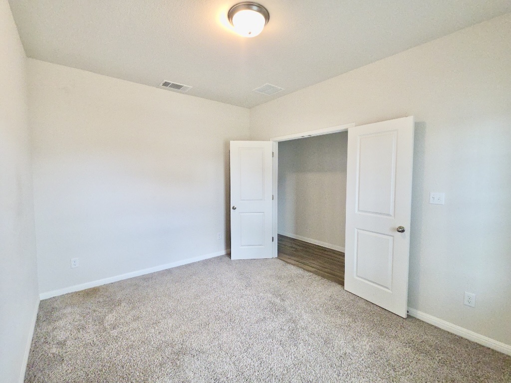 110 Grapefruit Road Hutto, TX 78634 - Photo 25 of 28 Office featuring neutral wall color and plush carpet flooring