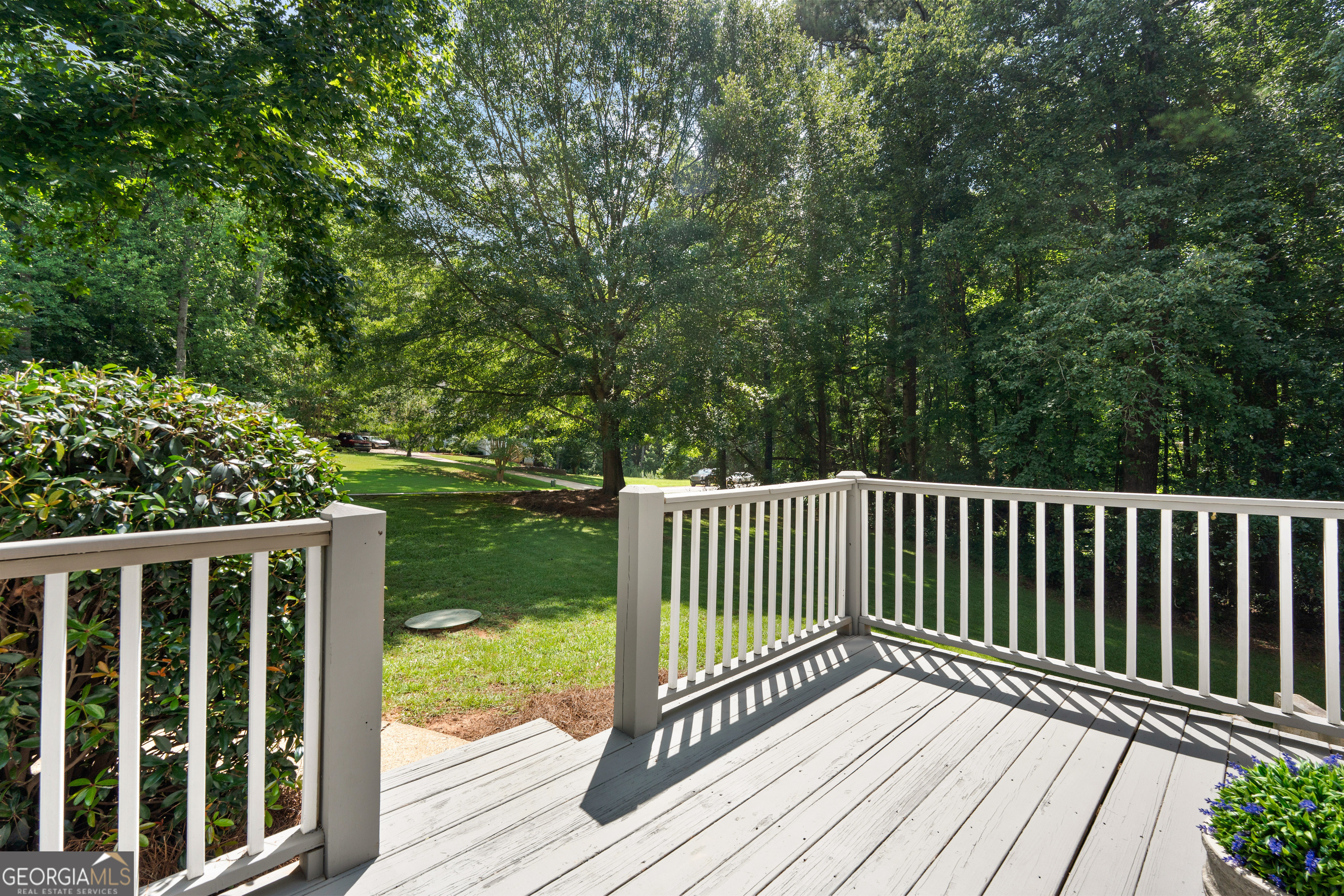 39 Springfield Court Newnan, GA 30265 - Photo 5 of 44 a view of balcony with wooden floor and fence