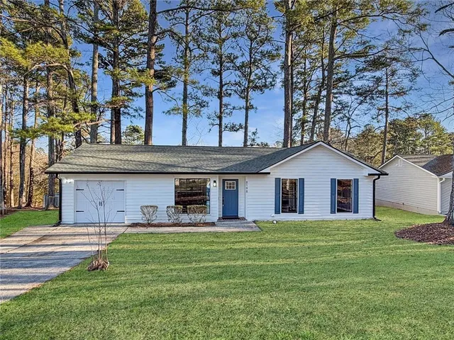 front view of a house with a yard