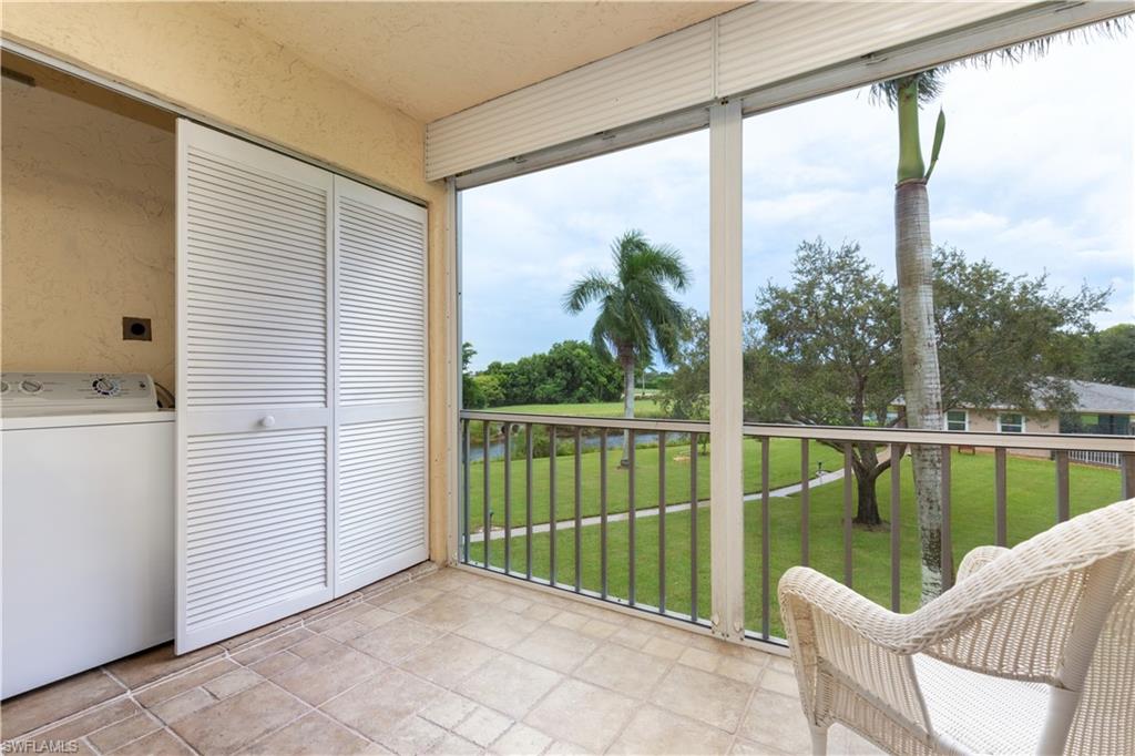 5467 Rattlesnake Hammock Road, Unit 202C Naples, FL 34113 - Photo 10 of 18 a balcony view with a lake view