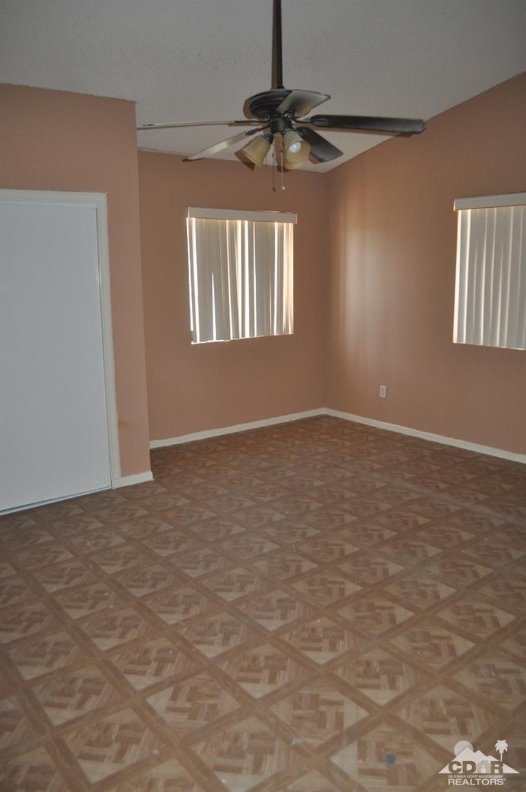 46531 Vargas Road Indio, CA 92201 - Photo 12 of 18 a view of an empty room with a window