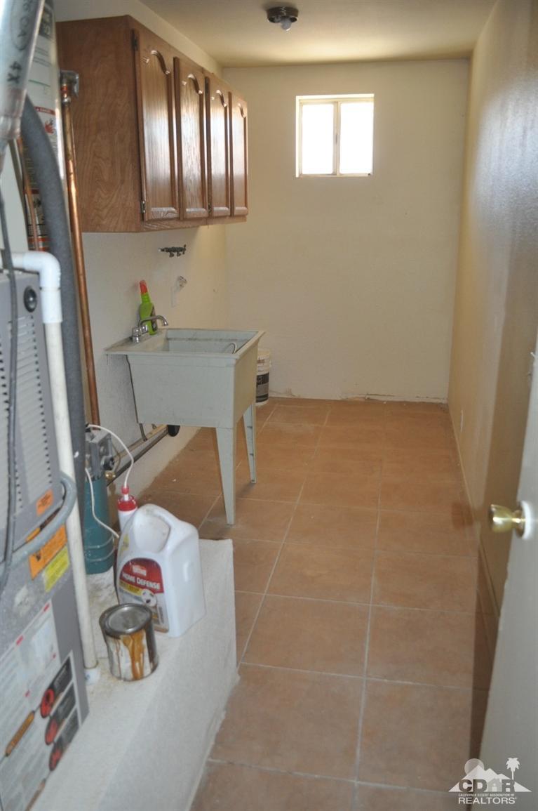 46531 Vargas Road Indio, CA 92201 - Photo 13 of 18 a bathroom with a sink and a shower