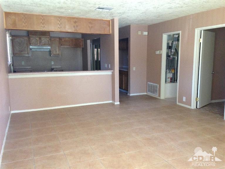 46531 Vargas Road Indio, CA 92201 - Photo 2 of 18 a view of a hallway with brick walls