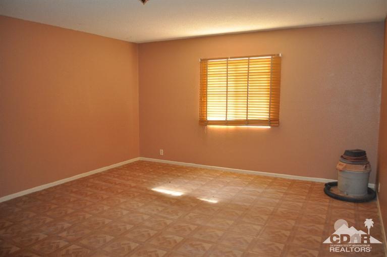 46531 Vargas Road Indio, CA 92201 - Photo 7 of 18 a view of an empty room with a window