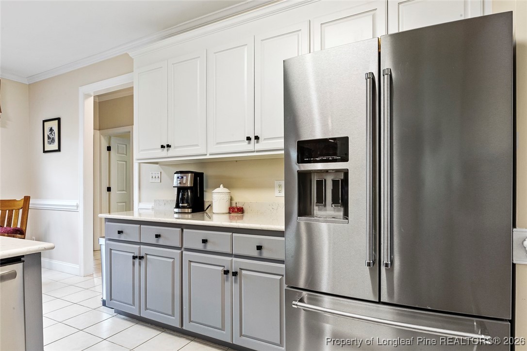514 Averette Road Rolesville, NC 27571 - Photo 12 of 38 a kitchen with stainless steel appliances a refrigerator and cabinets