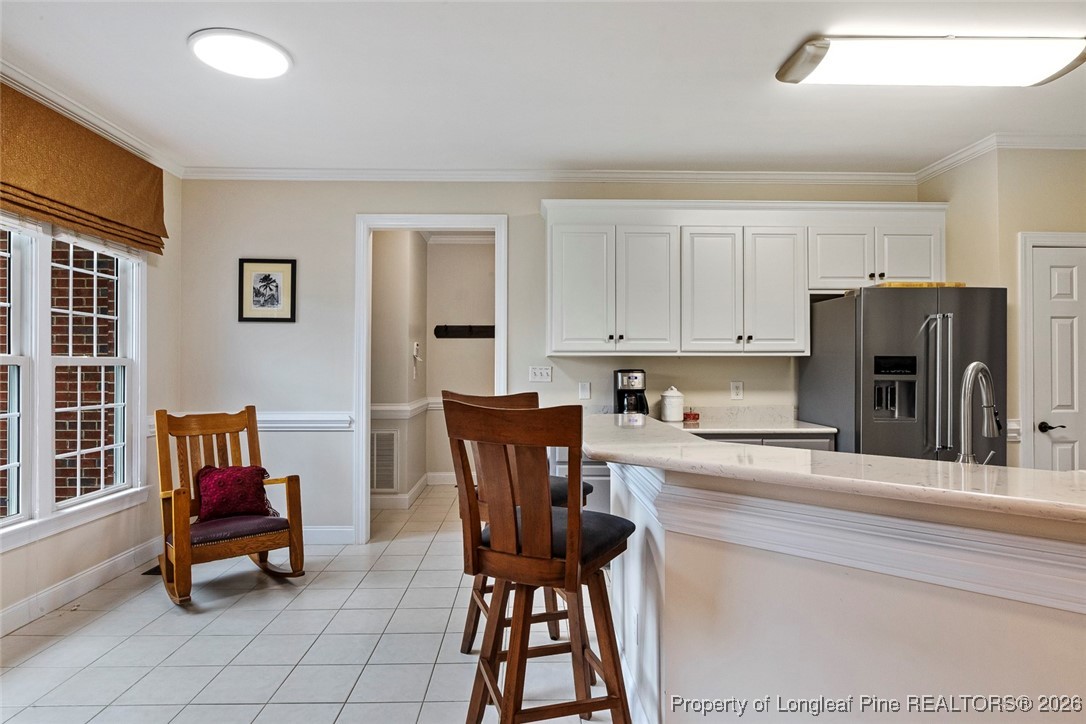 514 Averette Road Rolesville, NC 27571 - Photo 15 of 38 a kitchen with stainless steel appliances kitchen island granite countertop a refrigerator and a stove top oven