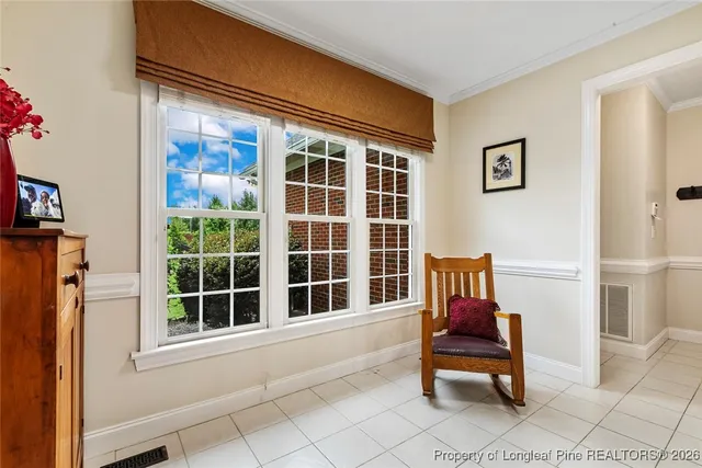 a view of a two chairs in the balcony