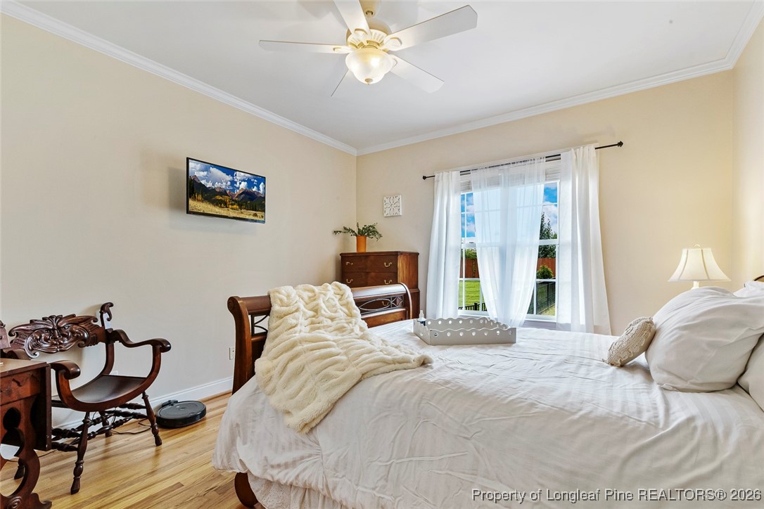 514 Averette Road Rolesville, NC 27571 - Photo 25 of 38 a bedroom with a bed and table chair