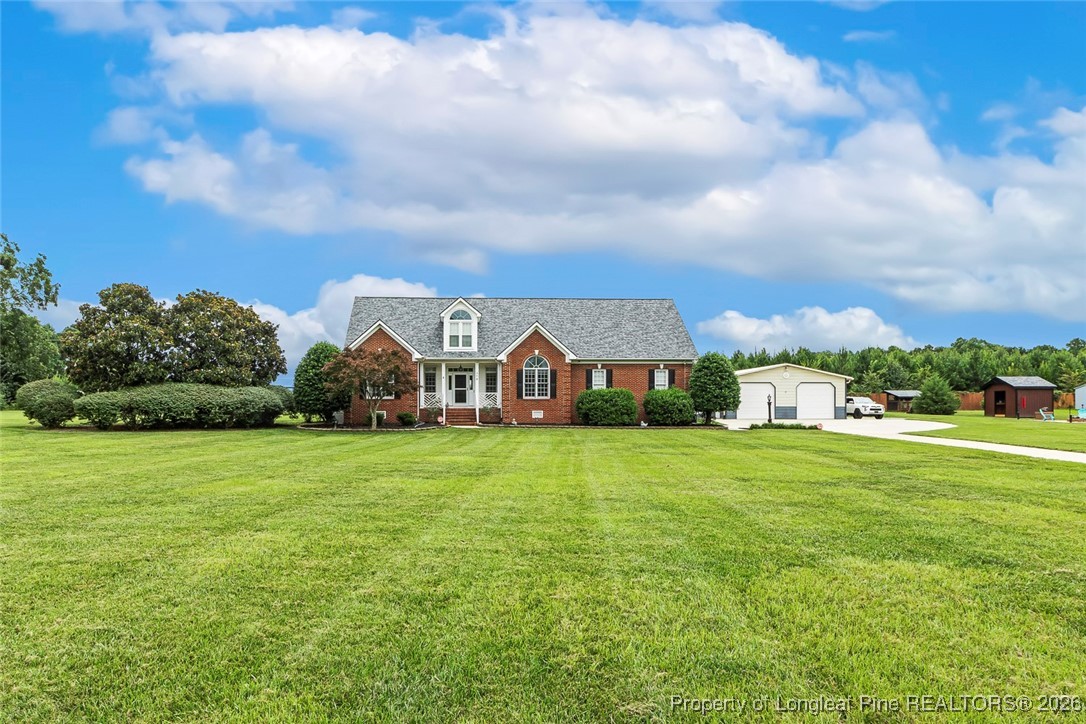 514 Averette Road Rolesville, NC 27571 - Photo 3 of 38 a view of a big yard with a house in the background