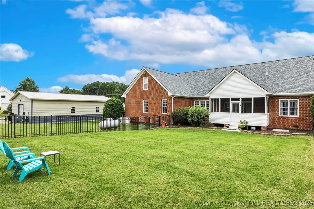 514 Averette Road Rolesville, NC 27571 - Photo 32 of 38 a view of a house with a yard and sitting area