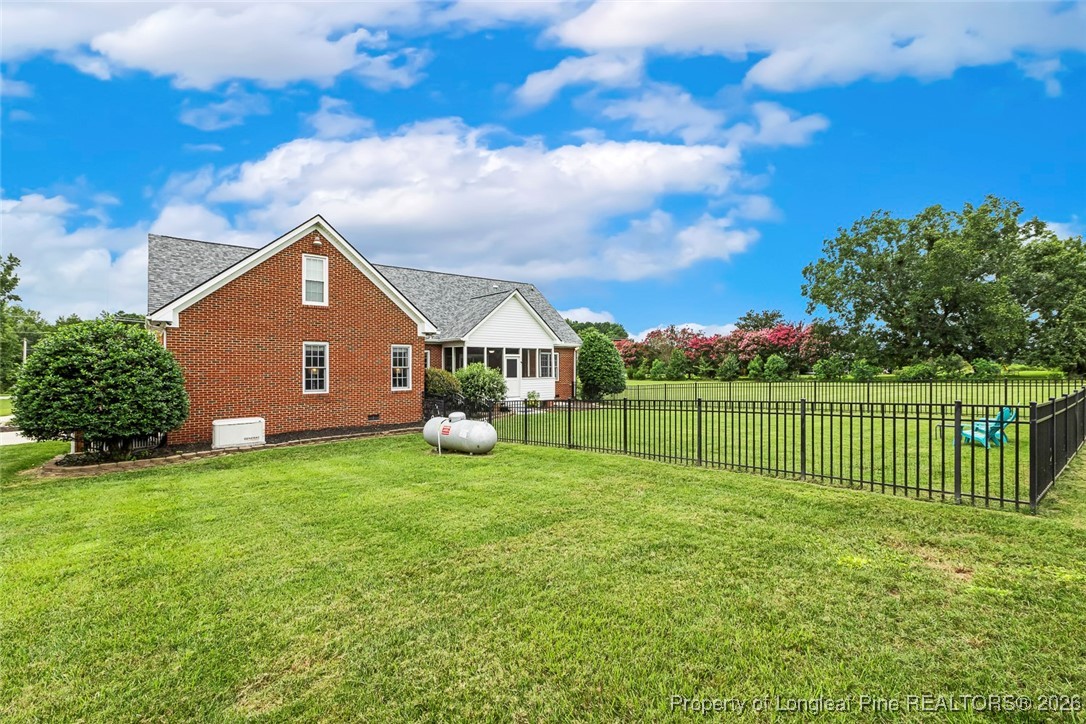 514 Averette Road Rolesville, NC 27571 - Photo 35 of 38 a view of a house with a yard and a garden