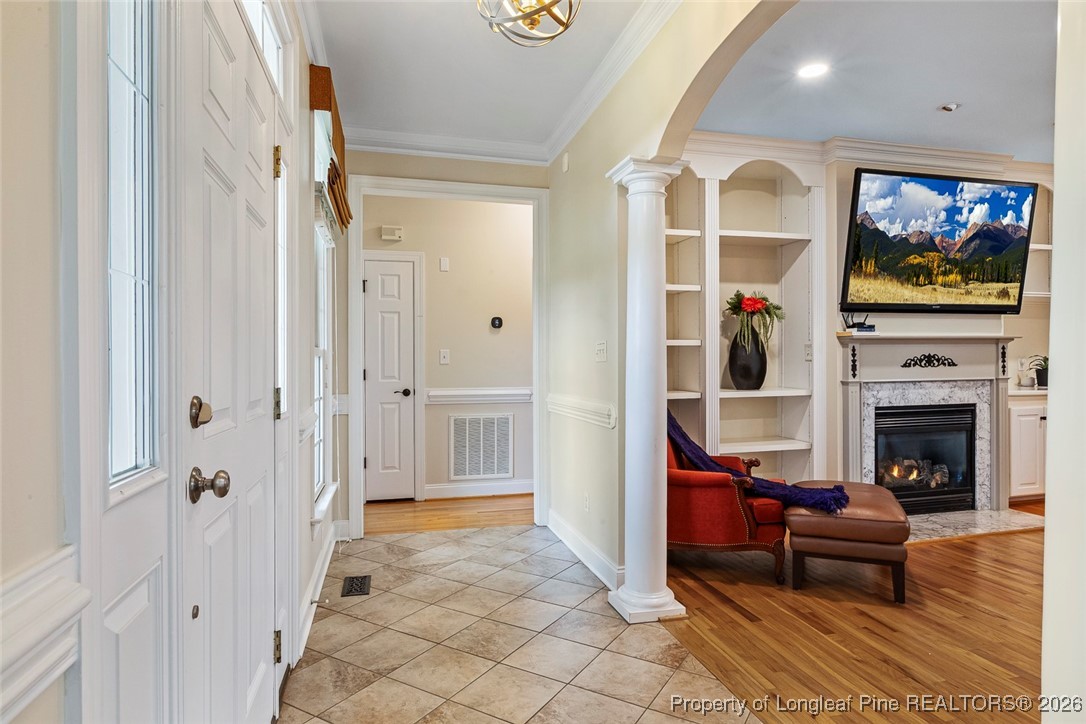514 Averette Road Rolesville, NC 27571 - Photo 5 of 38 a living room with furniture a flat screen tv and a fireplace