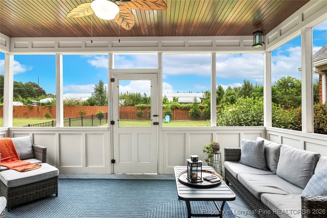 514 Averette Road Rolesville, NC 27571 - Photo 10 of 38 a living room with furniture and a floor to ceiling window