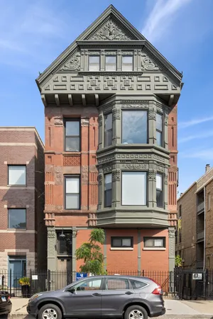 a front view of a house with a parking space