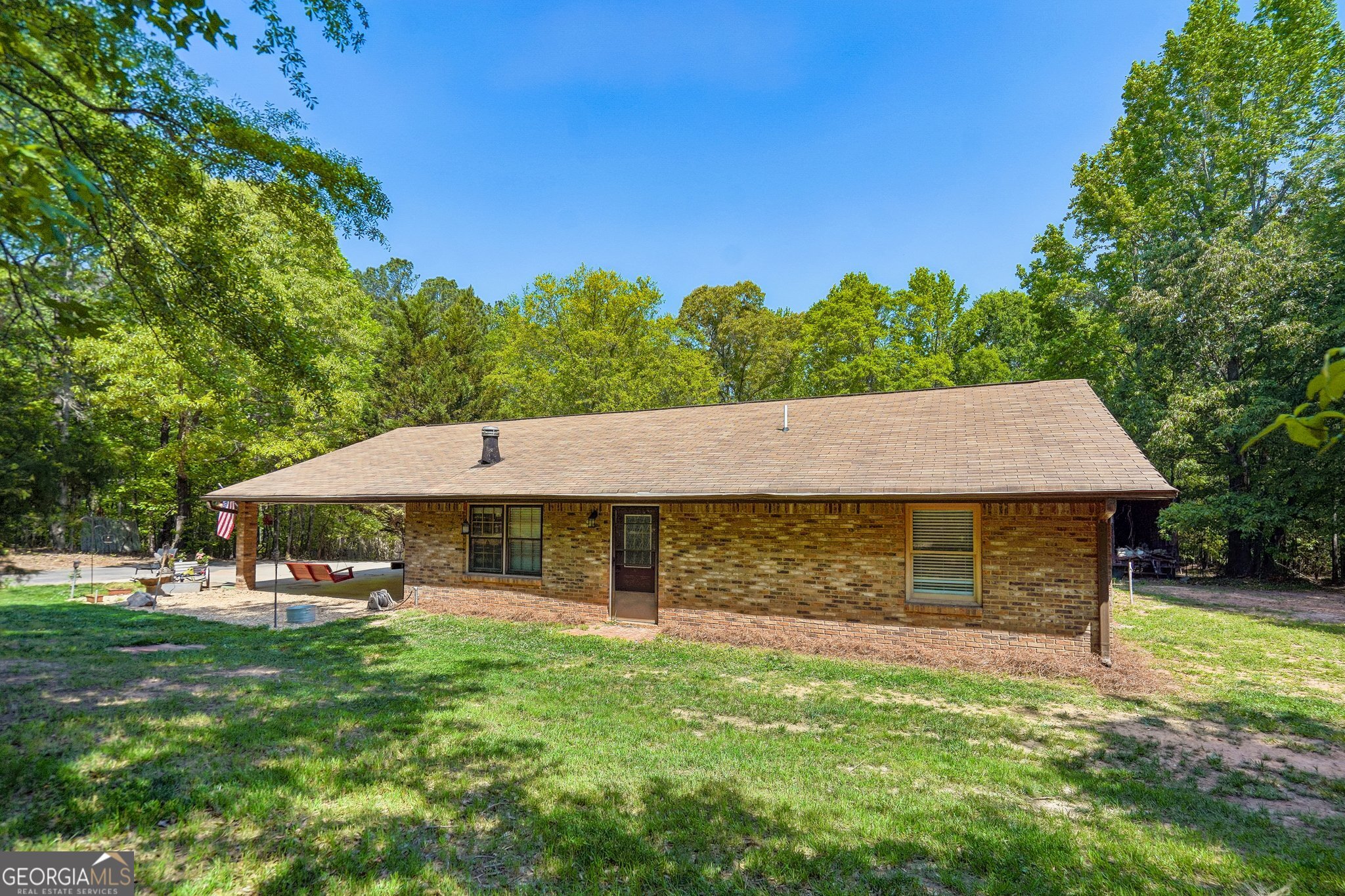 241 Busbin Road Fayetteville, GA 30215 - Photo 1 of 45 a view of a house with a yard