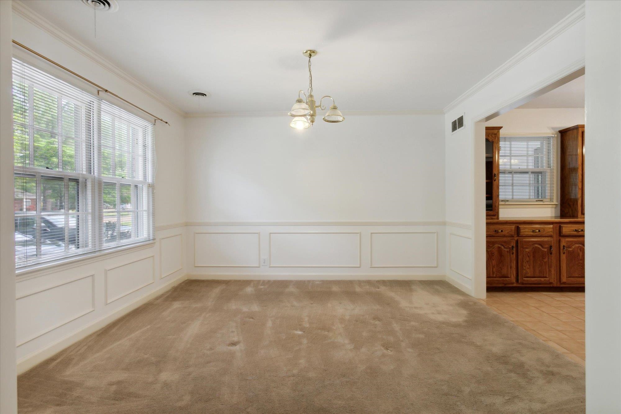 6173 Ivanhoe Road Bartlett, TN 38134 - Photo 13 of 35 wooden floor in an empty room with a window