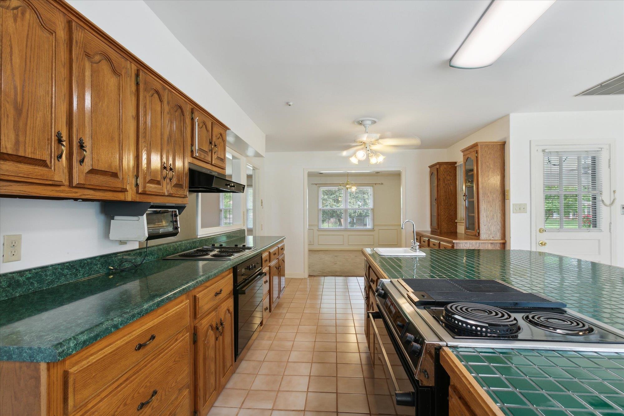 6173 Ivanhoe Road Bartlett, TN 38134 - Photo 17 of 35 a kitchen with stainless steel appliances granite countertop a stove and a sink