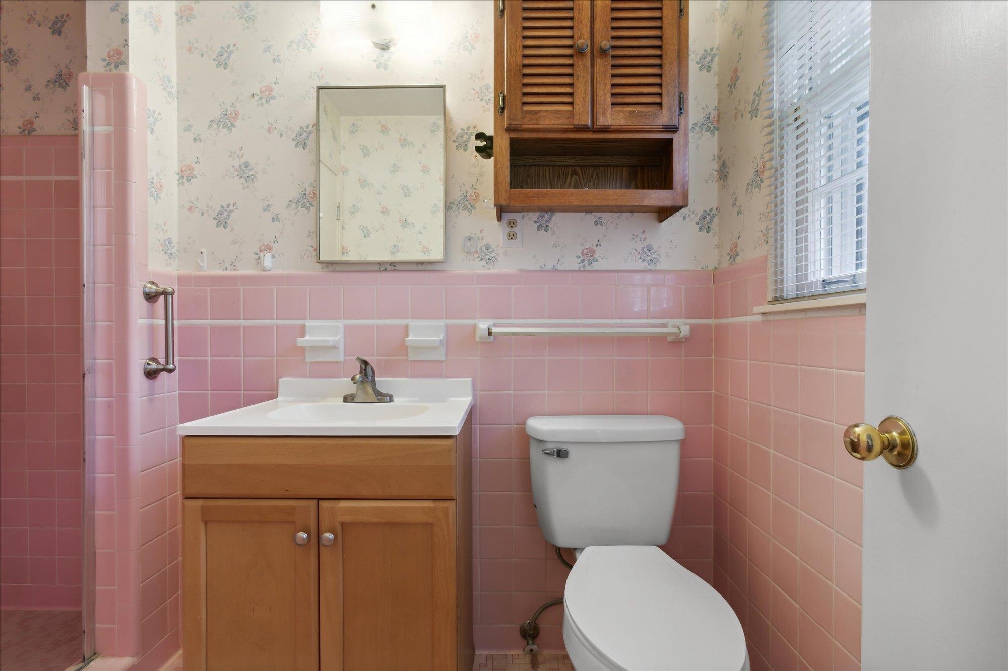 6173 Ivanhoe Road Bartlett, TN 38134 - Photo 28 of 35 a bathroom with a toilet sink and mirror