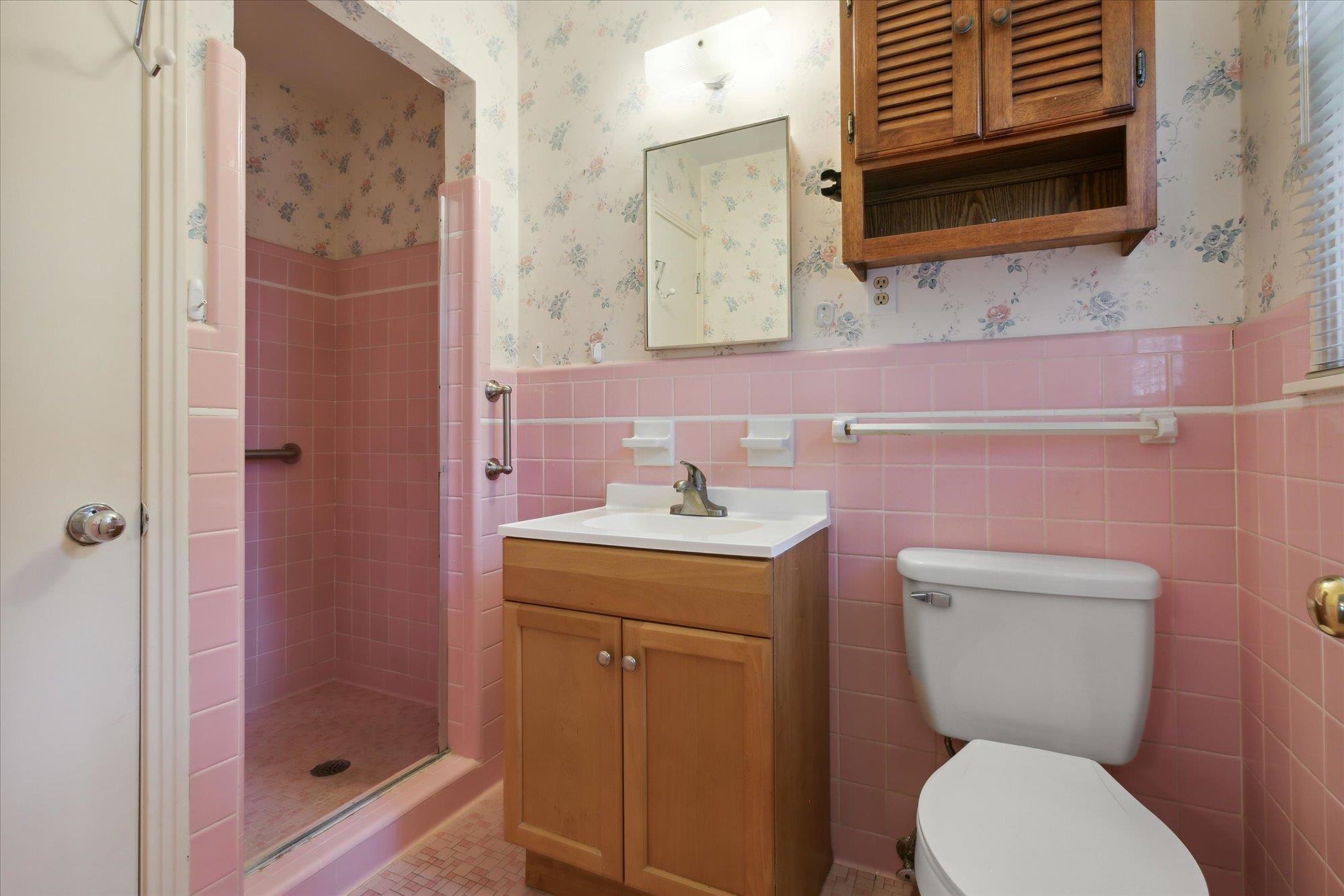 6173 Ivanhoe Road Bartlett, TN 38134 - Photo 29 of 35 a bathroom with a toilet sink and mirror