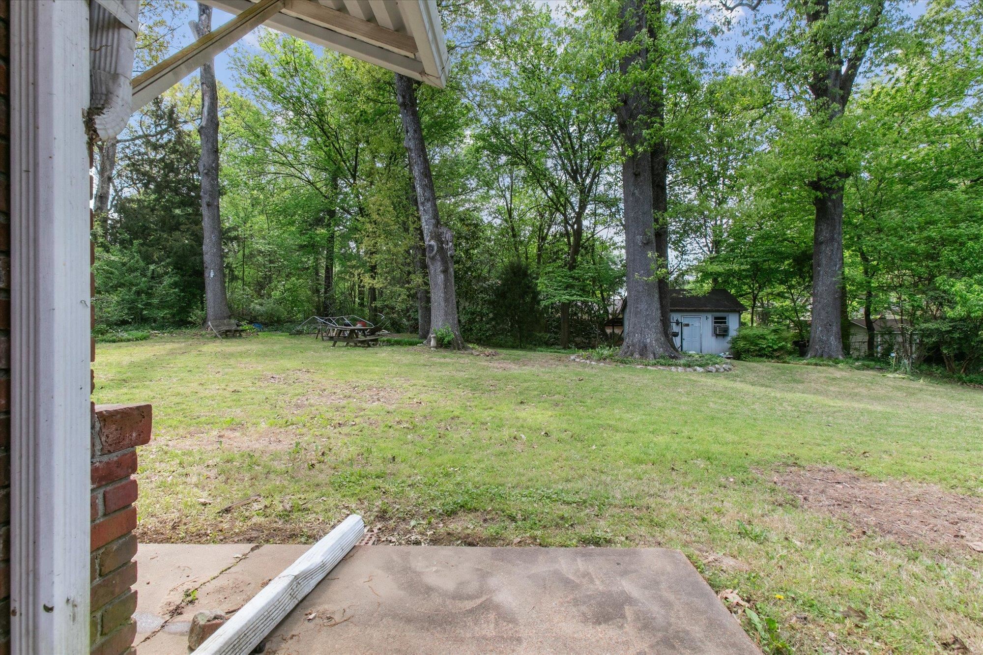 6173 Ivanhoe Road Bartlett, TN 38134 - Photo 33 of 35 a view of a yard with a trees