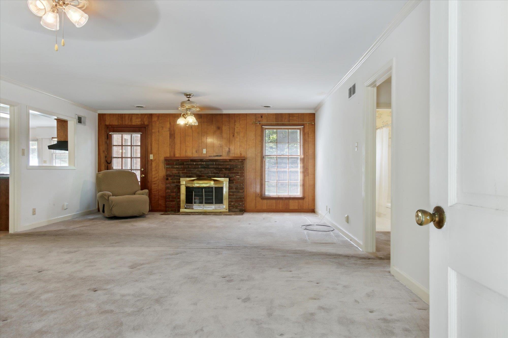 6173 Ivanhoe Road Bartlett, TN 38134 - Photo 9 of 35 a view of an empty room with window and fireplace