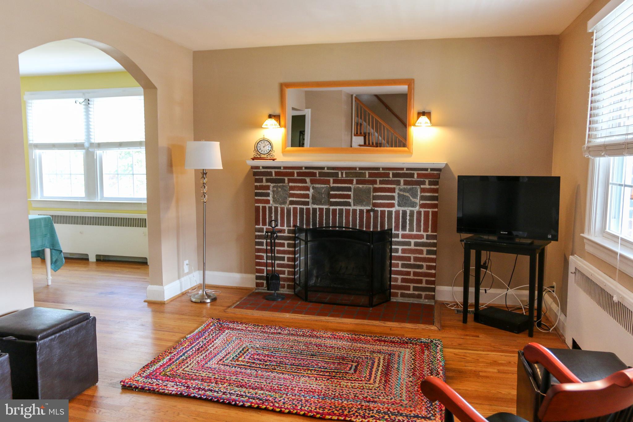 4208 Fordham Road Baltimore, MD 21229 - Photo 2 of 37 Living room with wood burning fireplace
