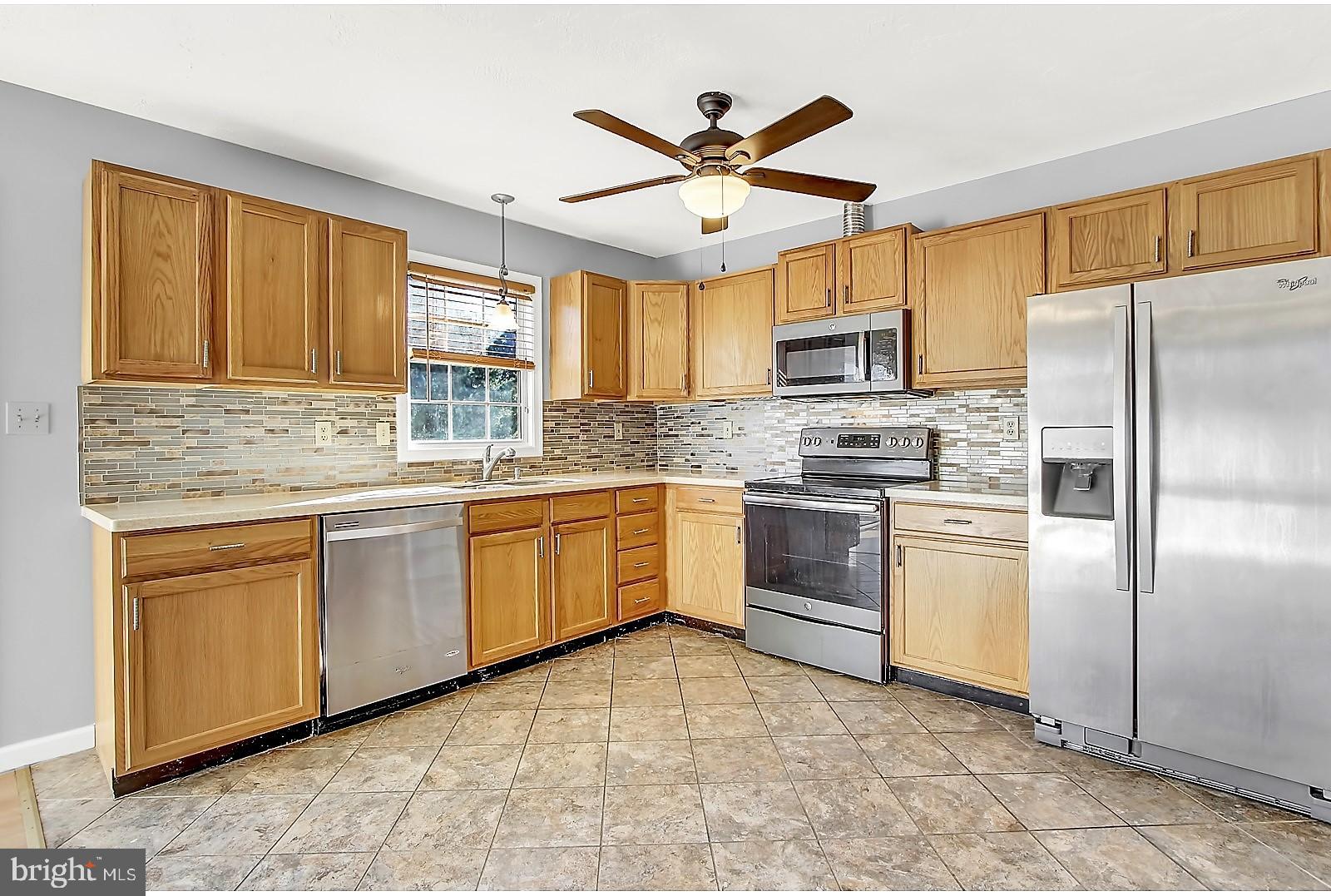 1663 Taylor Drive Hanover, PA 17331 - Photo 12 of 29 a kitchen with granite countertop appliances cabinets a sink and a window