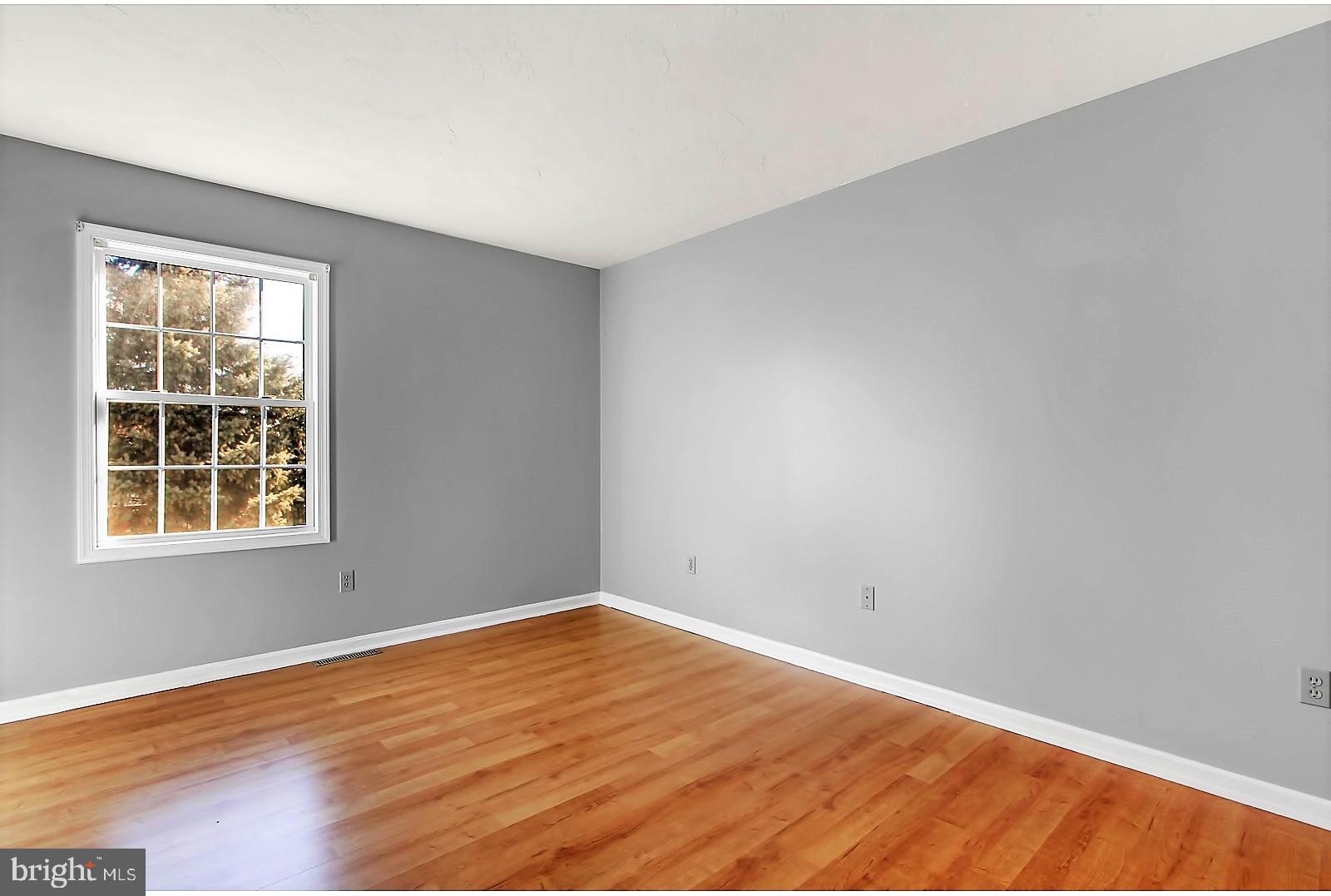 1663 Taylor Drive Hanover, PA 17331 - Photo 15 of 29 an empty room with wooden floor and windows