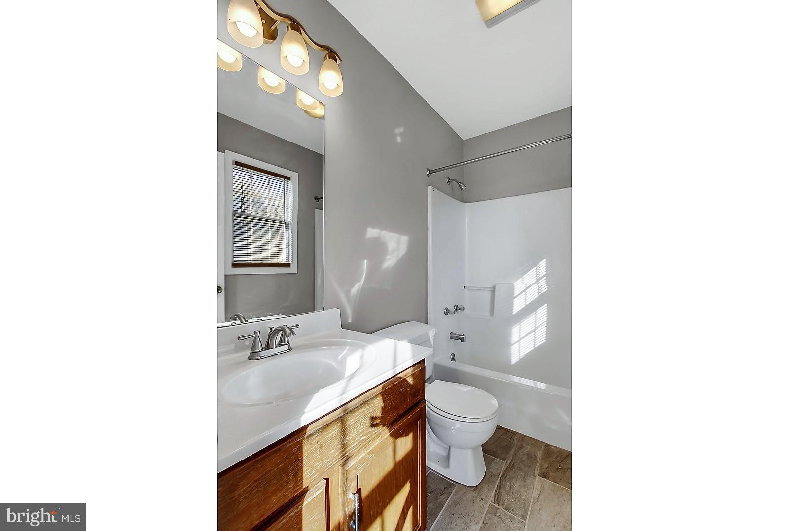 1663 Taylor Drive Hanover, PA 17331 - Photo 16 of 29 a bathroom with a sink toilet and a mirror