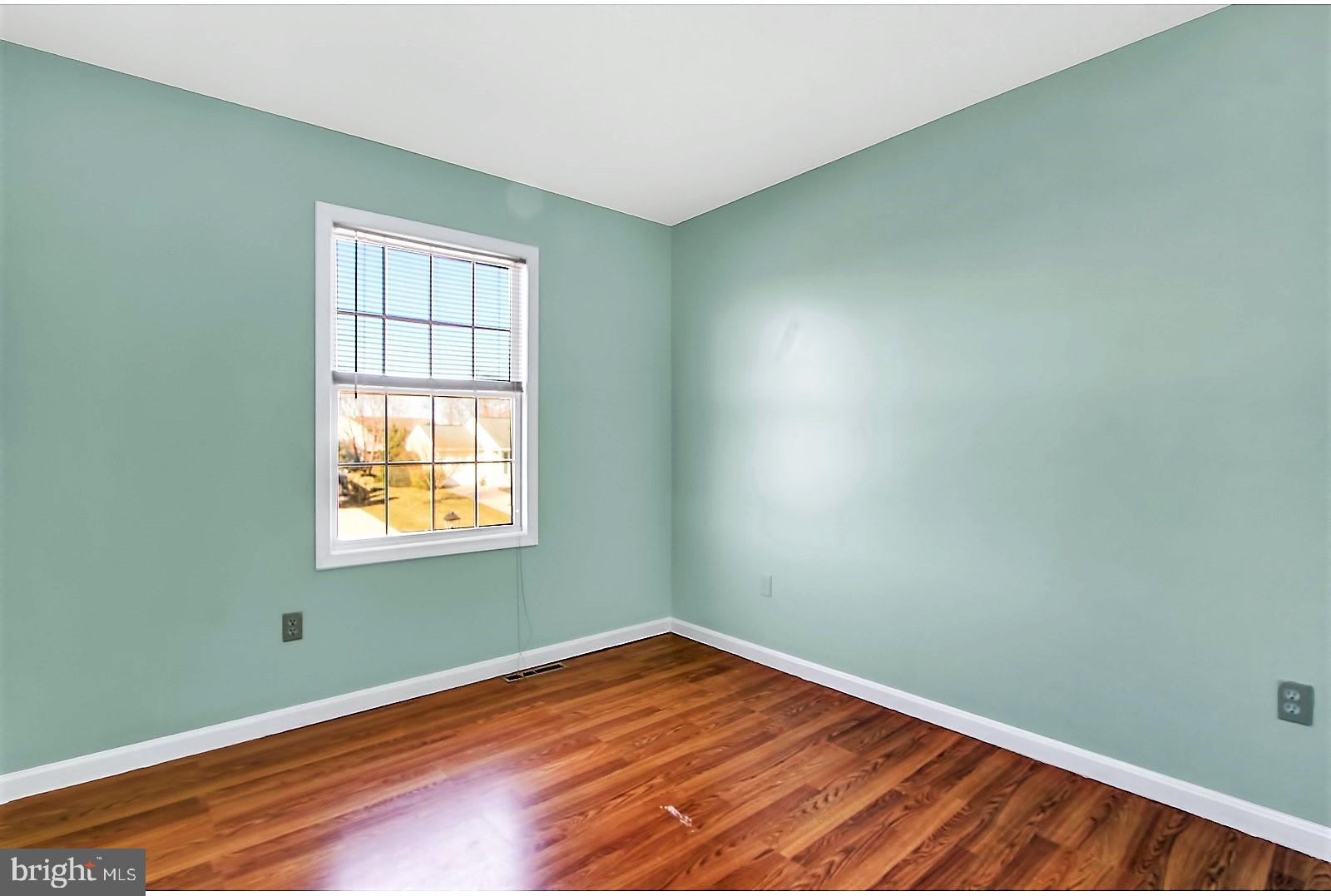 1663 Taylor Drive Hanover, PA 17331 - Photo 17 of 29 an empty room with wooden floor and windows