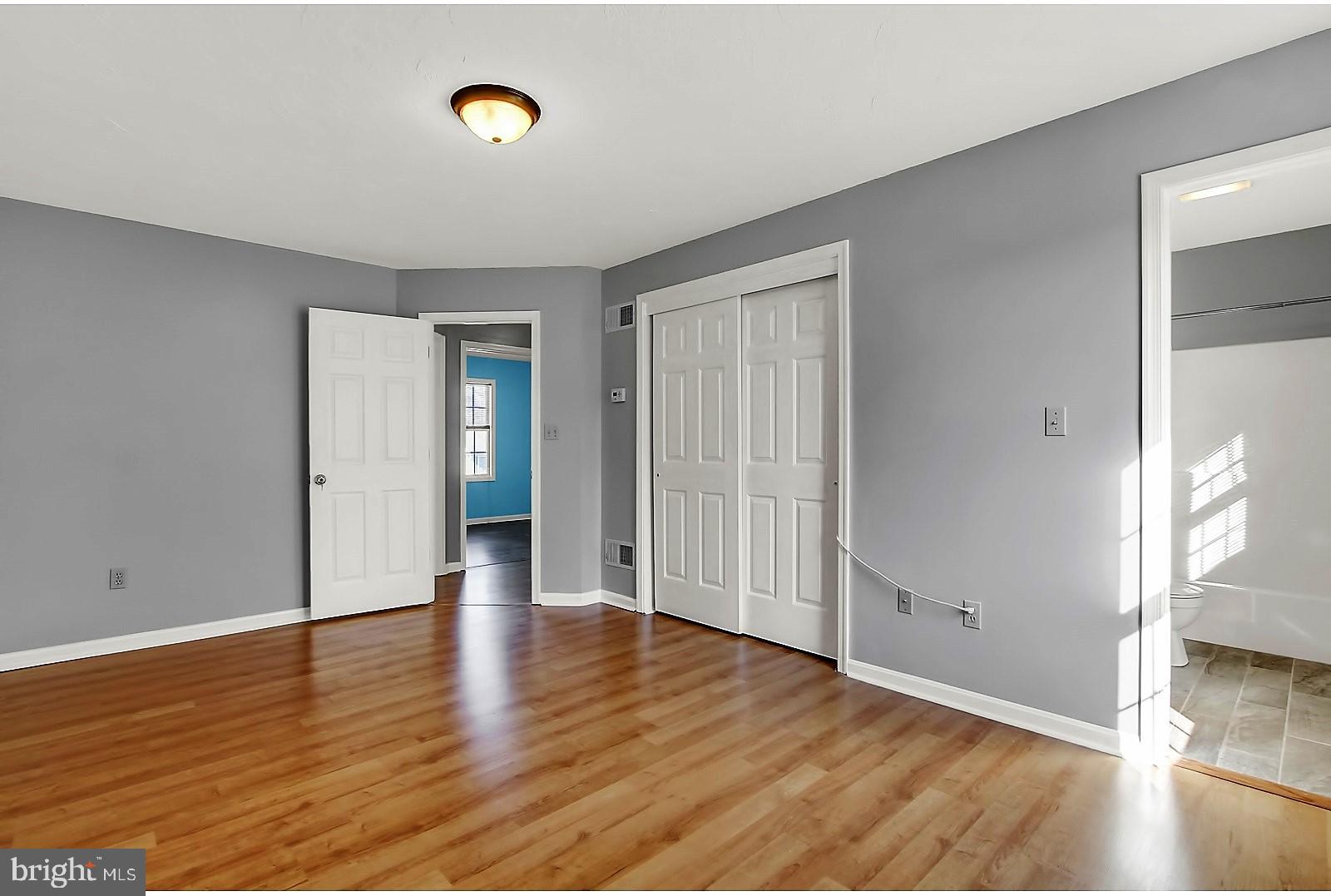 1663 Taylor Drive Hanover, PA 17331 - Photo 19 of 29 a view of an empty room with wooden floor and window