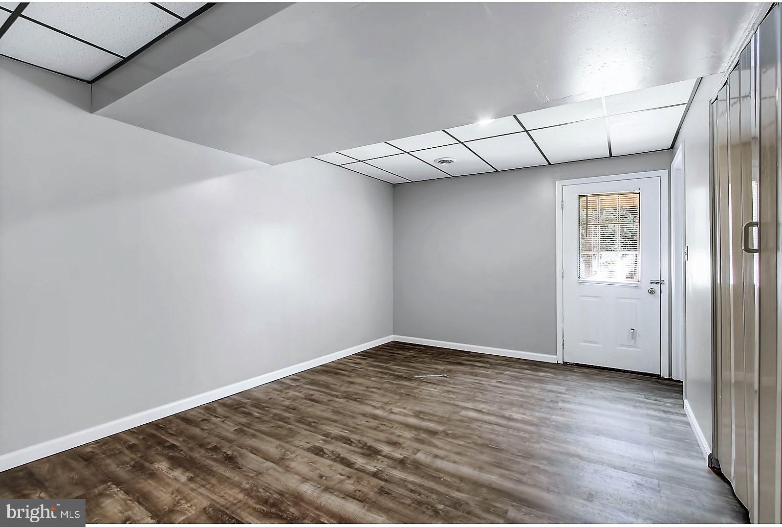 1663 Taylor Drive Hanover, PA 17331 - Photo 21 of 29 an empty room with wooden floor and windows