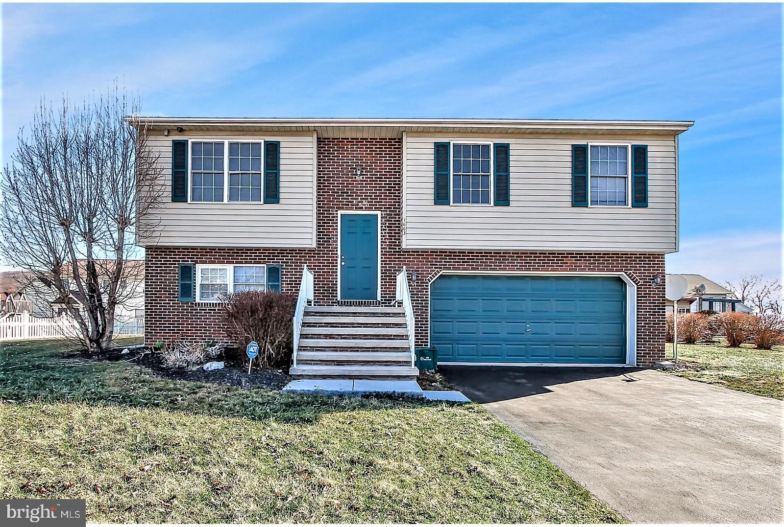 1663 Taylor Drive Hanover, PA 17331 - Photo 4 of 29 a front view of a house with a yard and garage