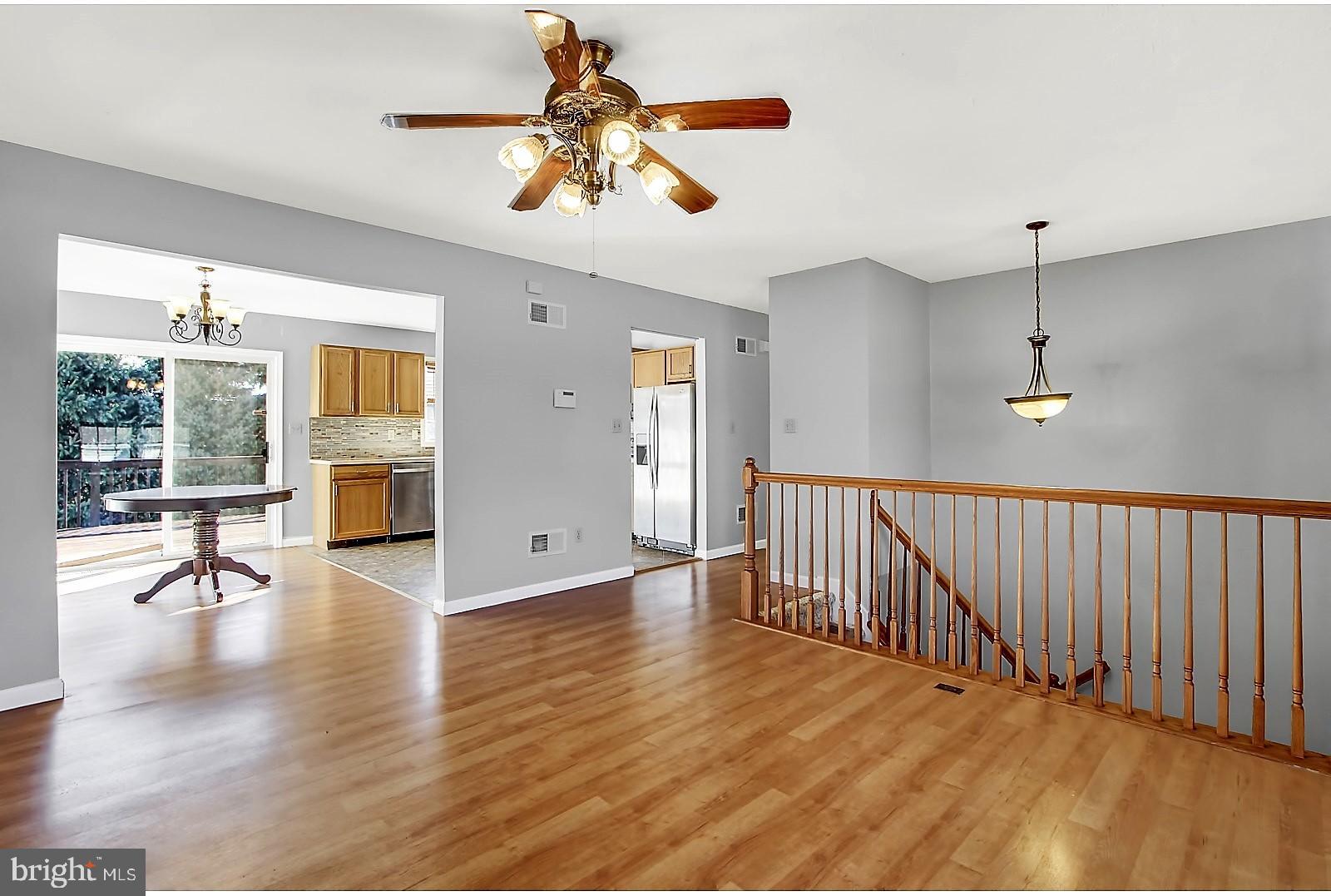 1663 Taylor Drive Hanover, PA 17331 - Photo 7 of 29 a view of an empty room with wooden floor and a window