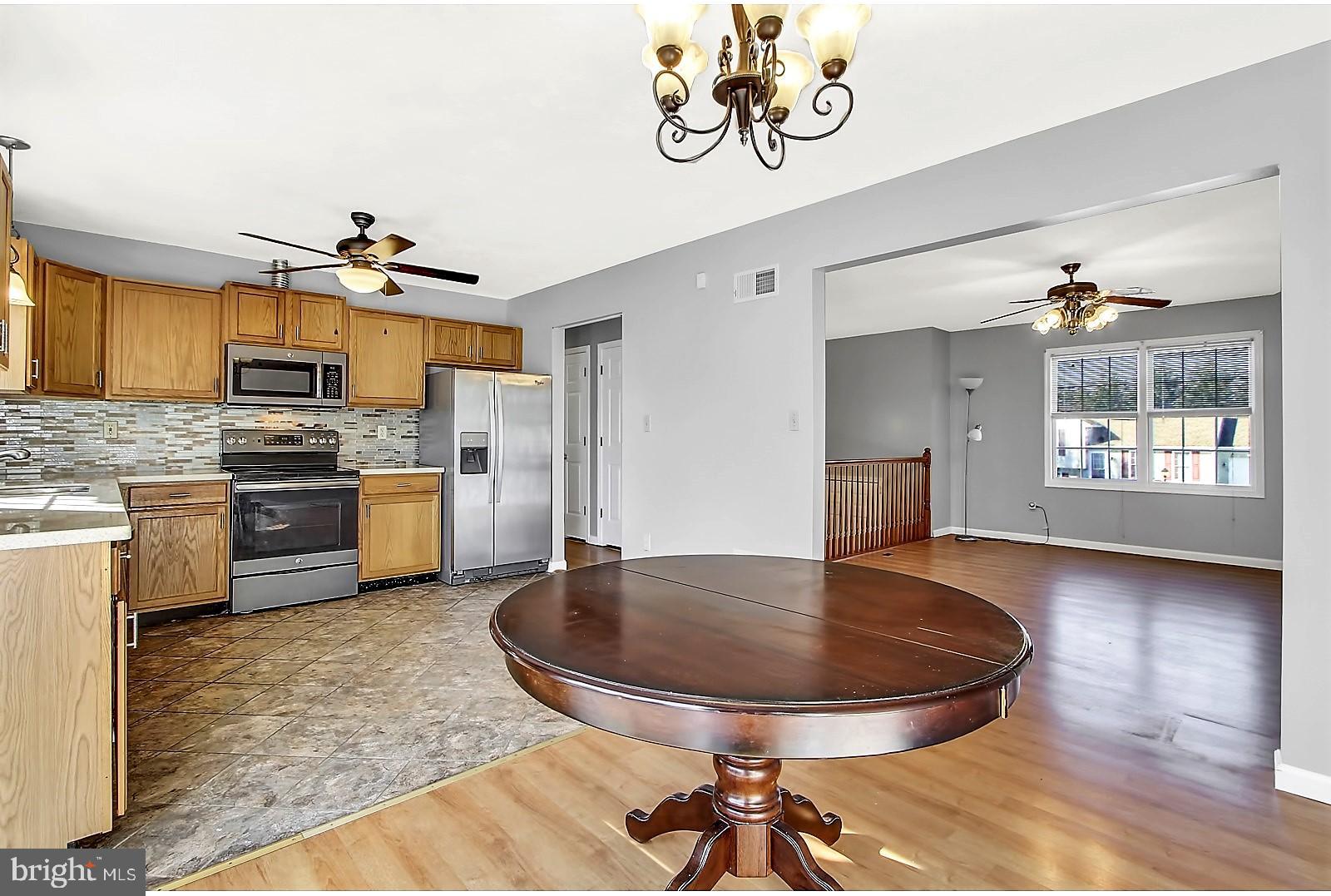 1663 Taylor Drive Hanover, PA 17331 - Photo 9 of 29 a kitchen with kitchen island a stove a table and chairs