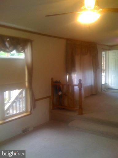 7959 Telegraph Road, Unit 43 Severn, MD 21144 - Photo 8 of 9 Step down to the large family room with fireplace.