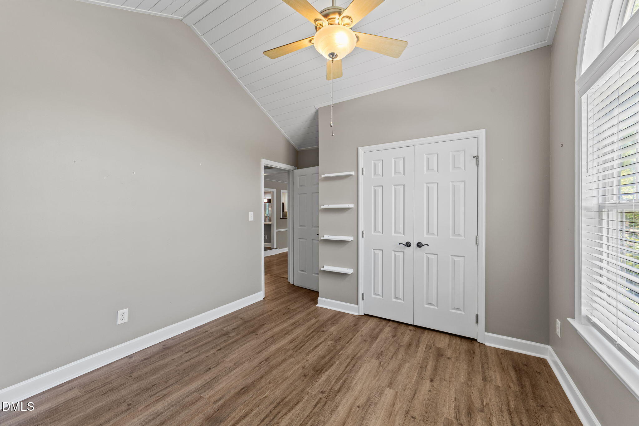 6820 Oviedo Drive Raleigh, NC 27603 - Photo 32 of 50 wooden floor in an empty room with a window
