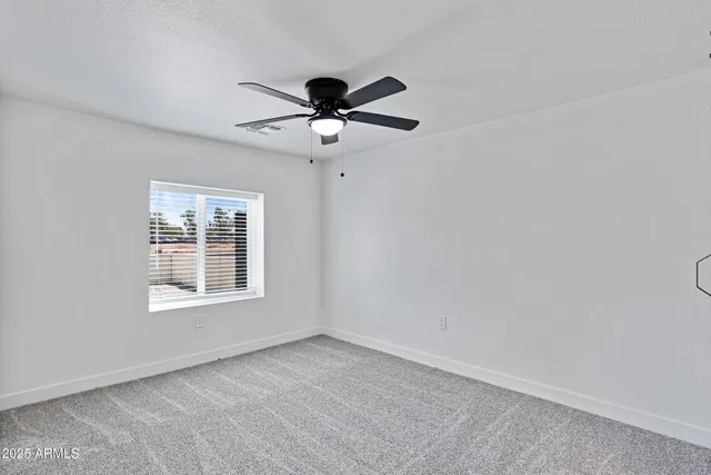 a bathroom with a double vanity sink mirror and toilet