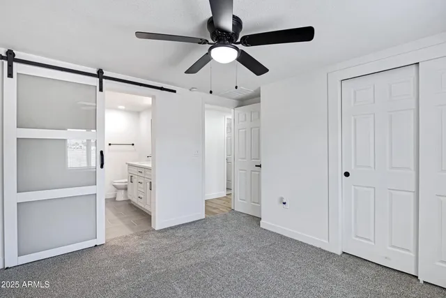 a bathroom with a tub a toilet and a sink