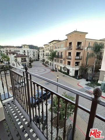 a view of a balcony with city view