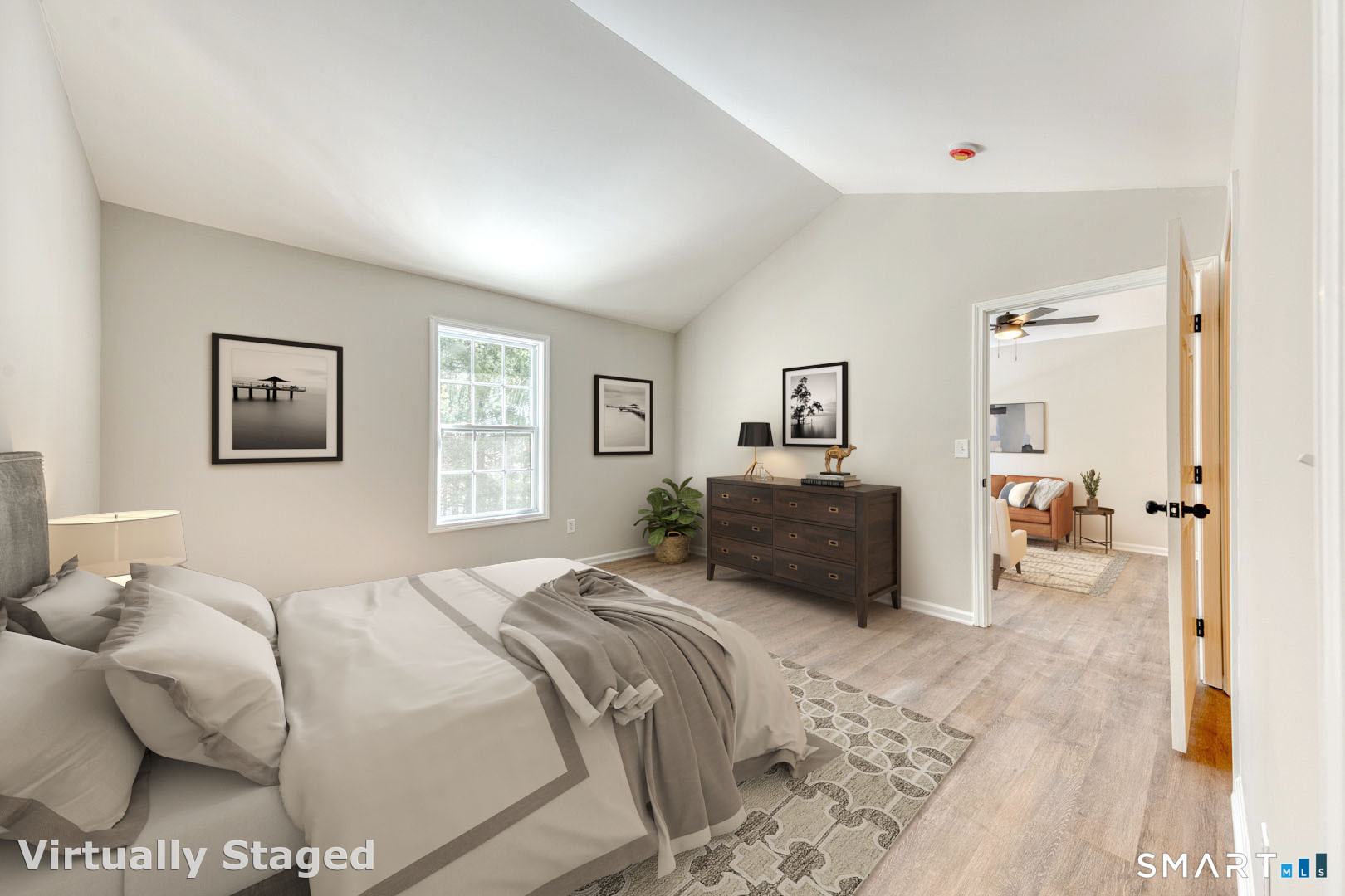 159 Jennifer Lane, Unit 159 Newtown, CT 06482 - Photo 21 of 32 a bedroom with a bed and wooden floor