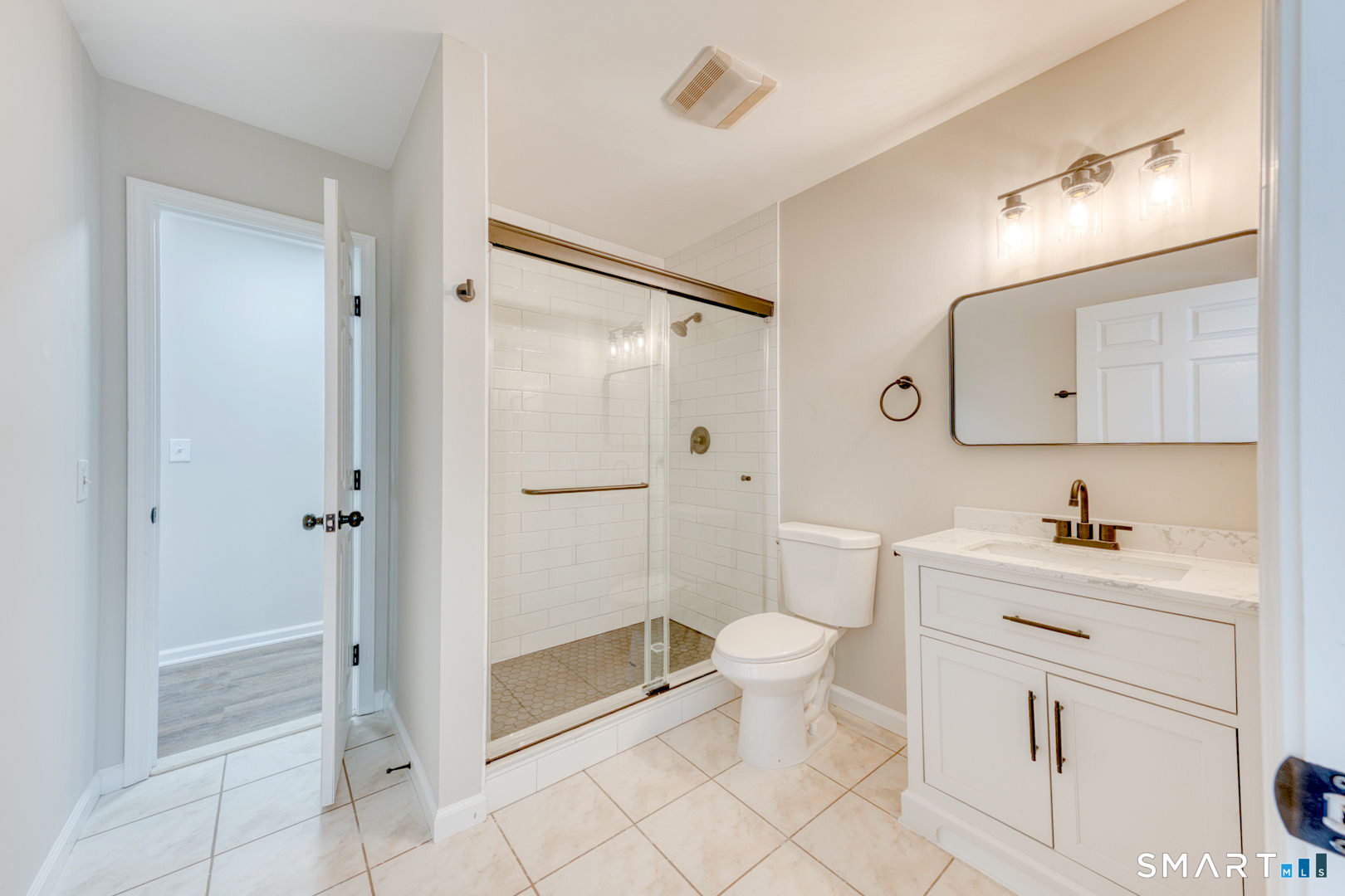 159 Jennifer Lane, Unit 159 Newtown, CT 06482 - Photo 22 of 29 a bathroom with a toilet a sink and shower