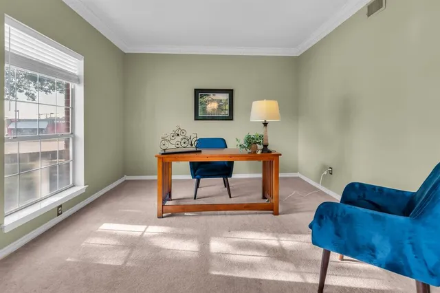 a workspace with furniture and window