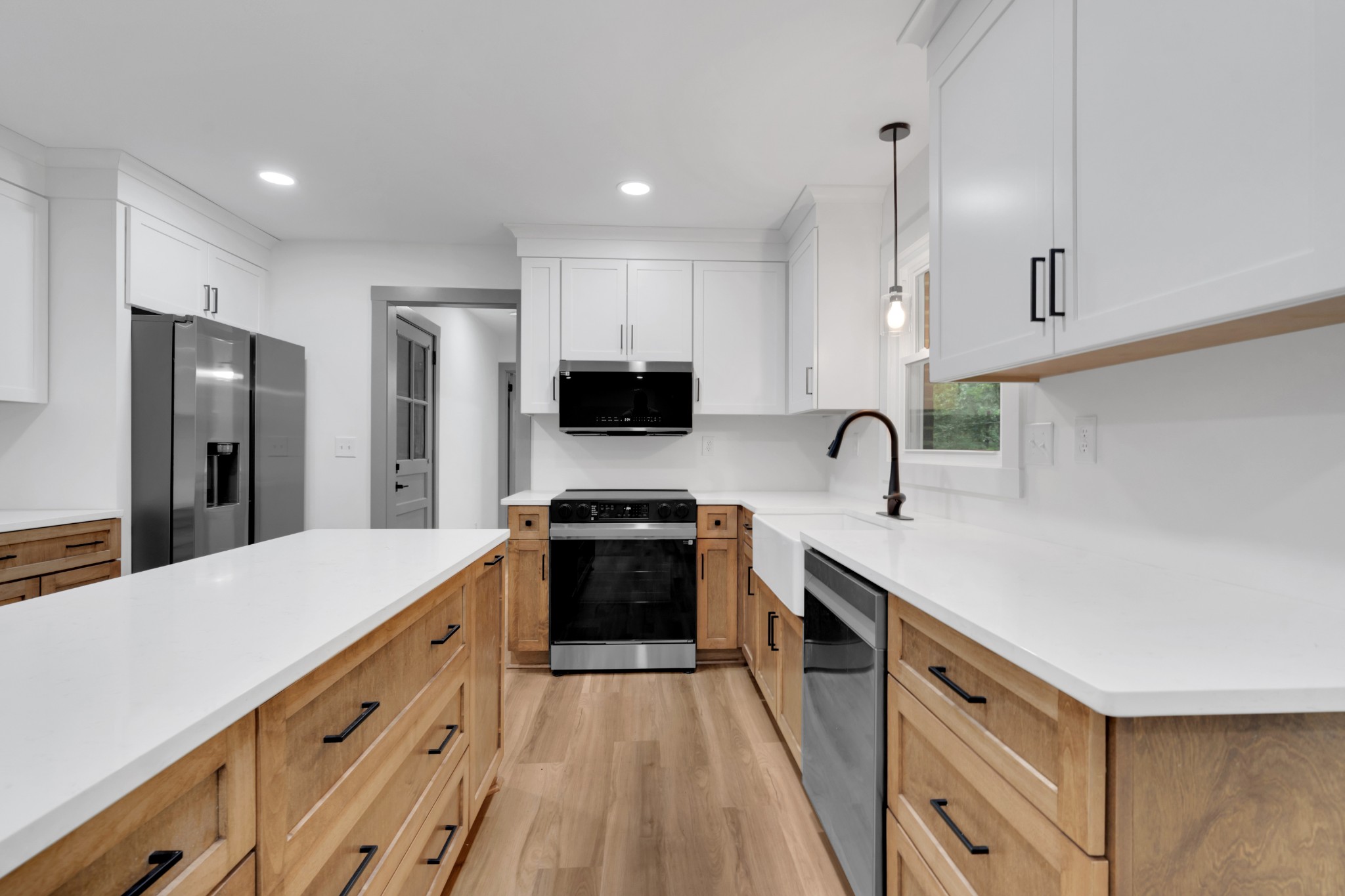 305 12 Oaks Road Tullahoma, TN 37388 - Photo 11 of 56 a kitchen with stainless steel appliances a sink stove refrigerator and cabinets