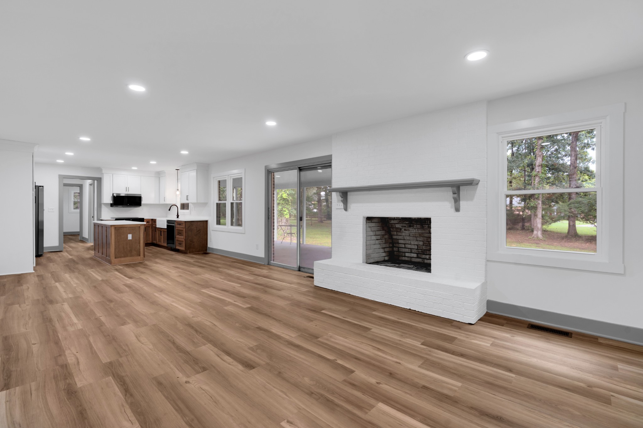 305 12 Oaks Road Tullahoma, TN 37388 - Photo 17 of 56 a view of an empty room with a fireplace and a window
