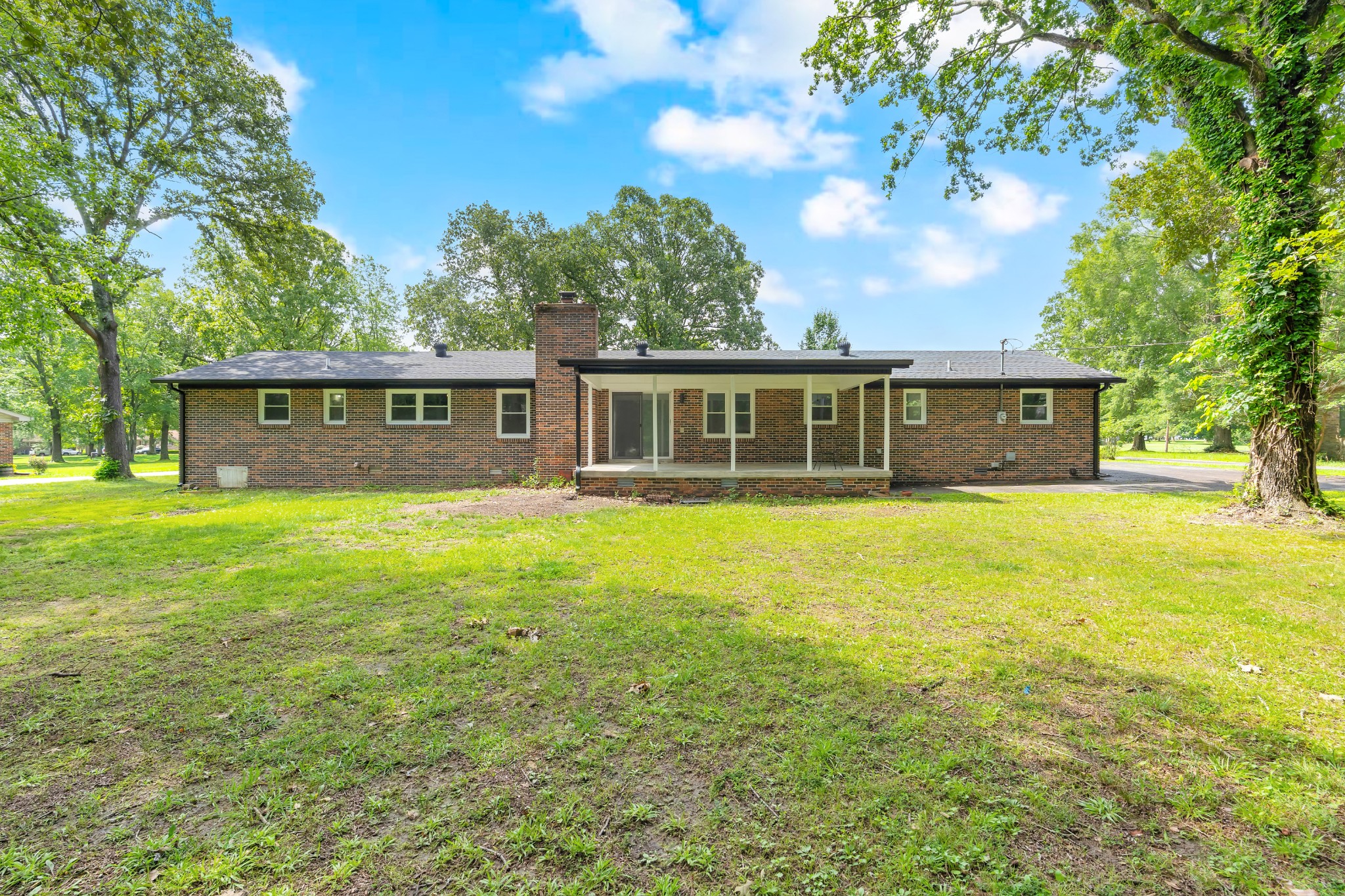 305 12 Oaks Road Tullahoma, TN 37388 - Photo 2 of 56 a view of a house with a backyard