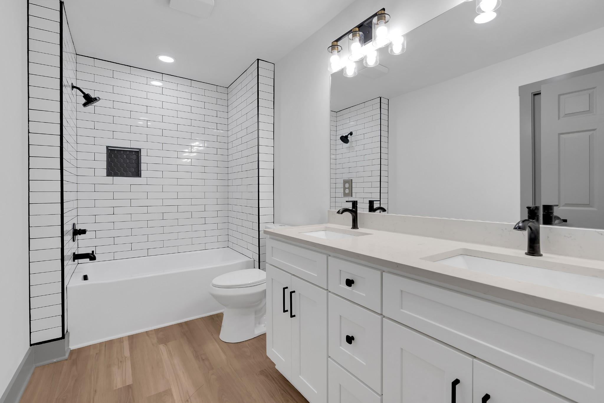 305 12 Oaks Road Tullahoma, TN 37388 - Photo 21 of 56 a bathroom with a double vanity sink toilet and shower
