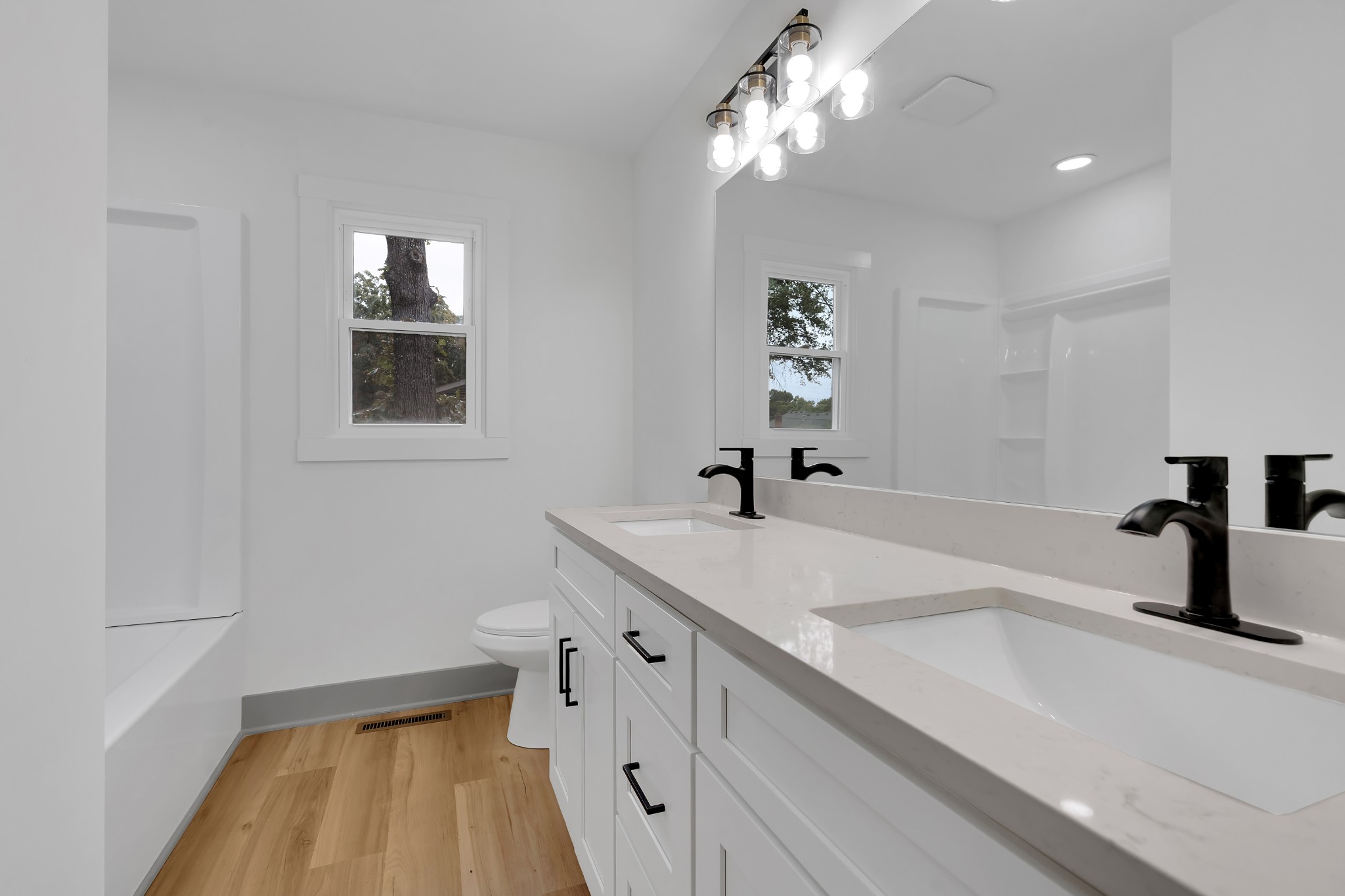 305 12 Oaks Road Tullahoma, TN 37388 - Photo 29 of 56 a bathroom with a sink a toilet and a mirror