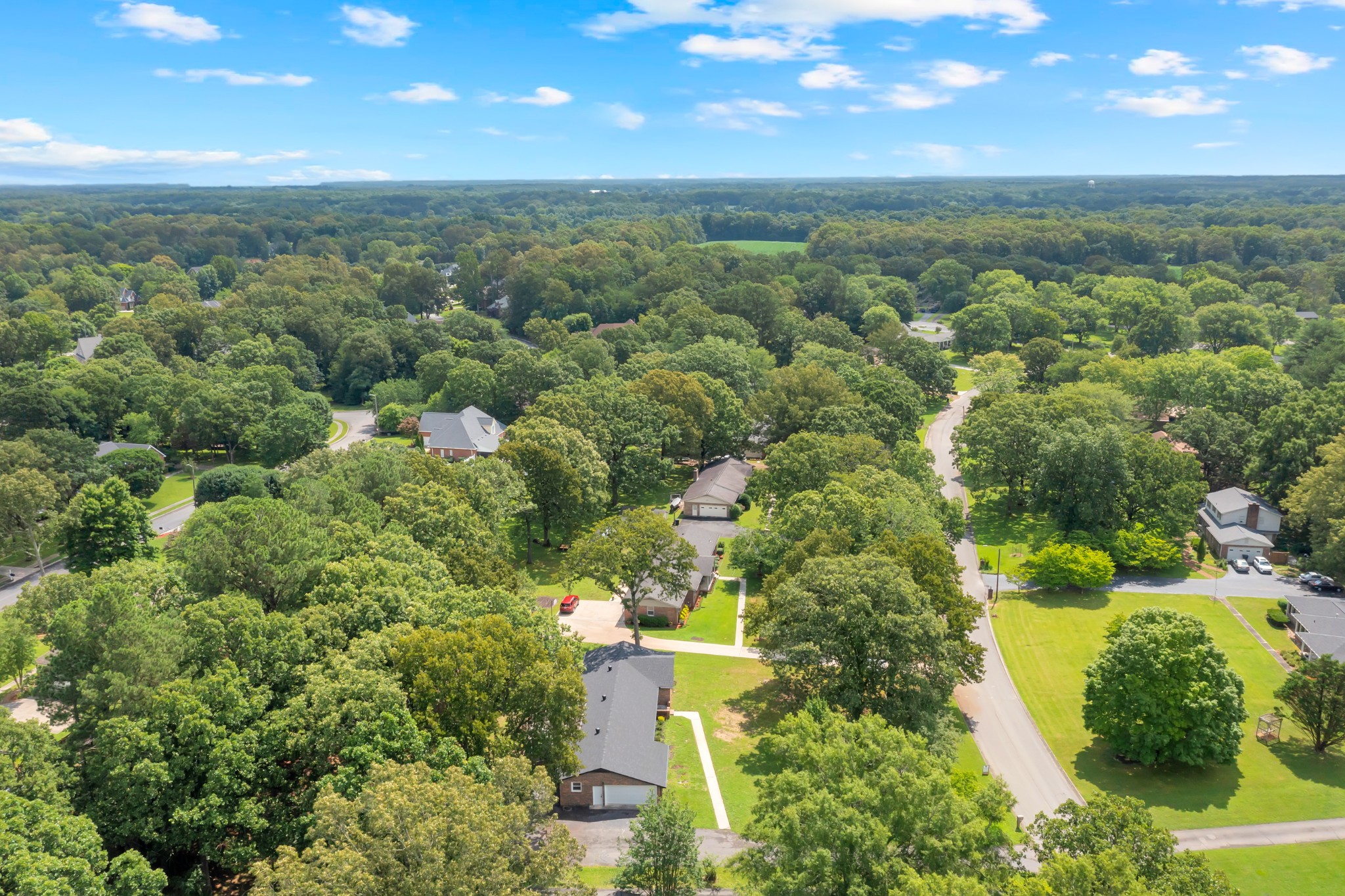305 12 Oaks Road Tullahoma, TN 37388 - Photo 41 of 56 an aerial view of residential houses with outdoor space and trees